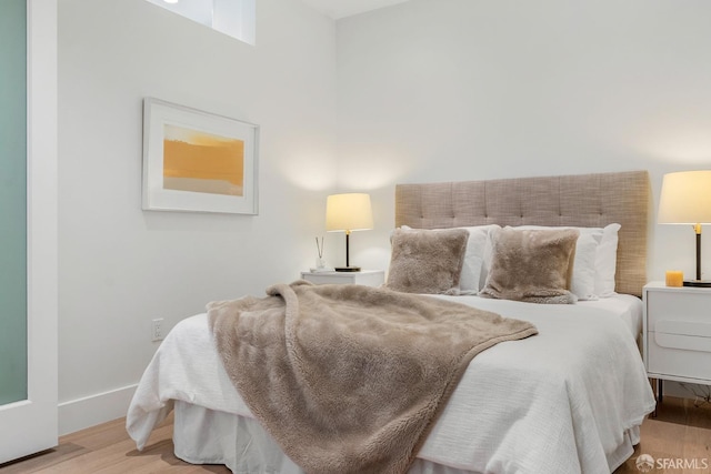 bedroom with light hardwood / wood-style floors