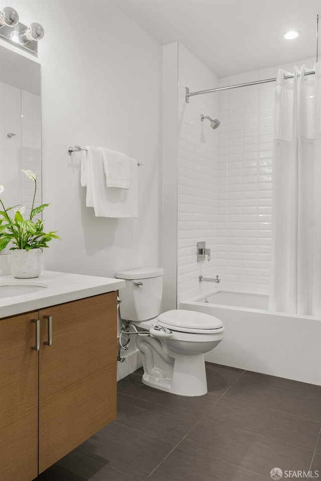 full bathroom featuring tile patterned flooring, vanity, shower / bath combo, and toilet