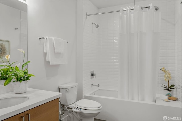 full bathroom featuring vanity, shower / bath combo, and toilet