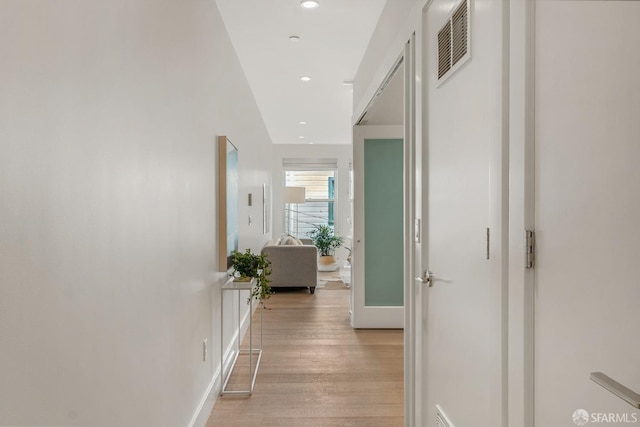 corridor featuring light hardwood / wood-style floors