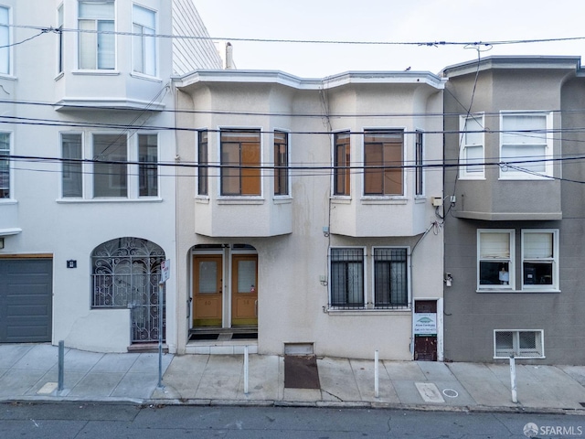 exterior space with stucco siding