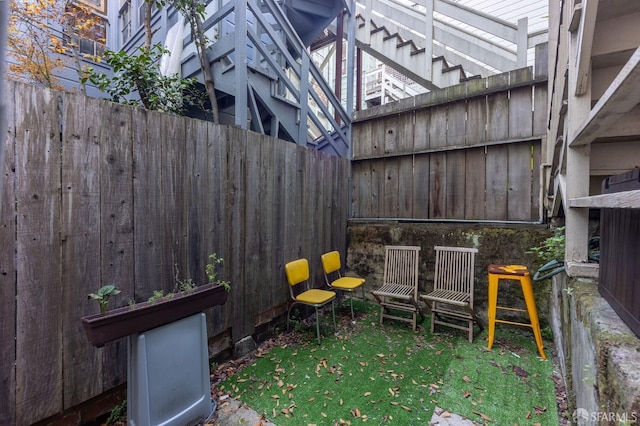 view of patio featuring fence