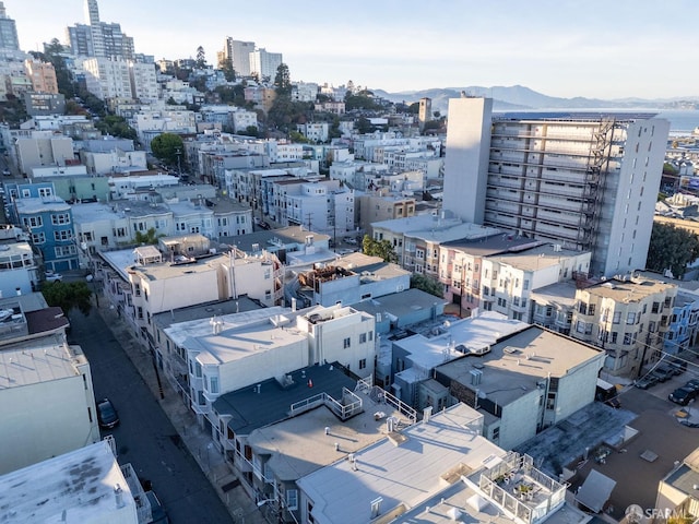 birds eye view of property featuring a view of city and a mountain view