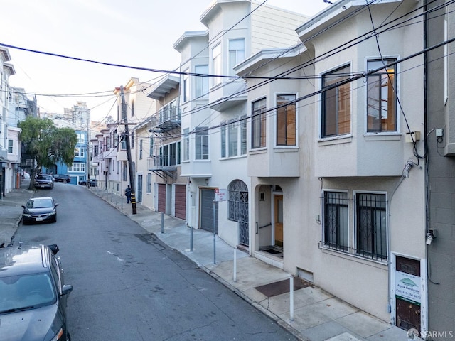 view of road with sidewalks and curbs