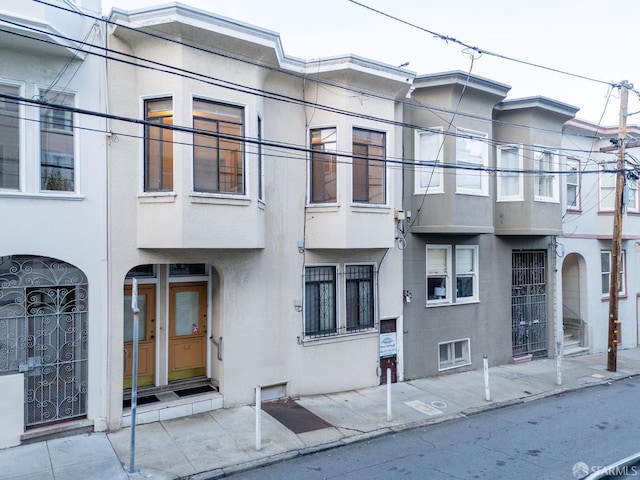 view of front of house featuring stucco siding