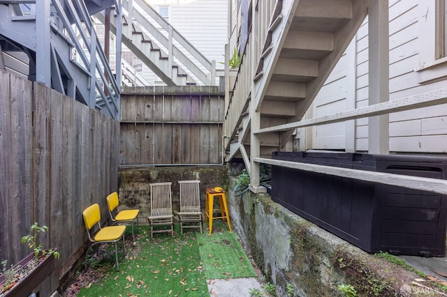 view of patio featuring fence