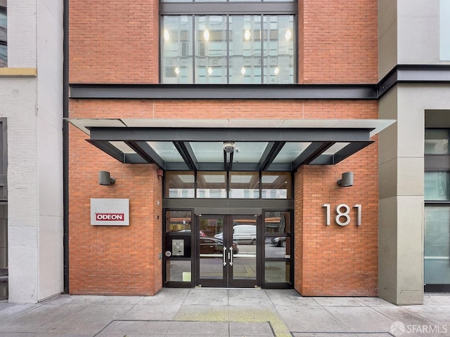 view of exterior entry featuring french doors