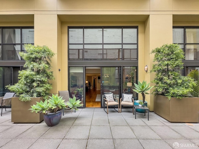 entrance to property with a patio