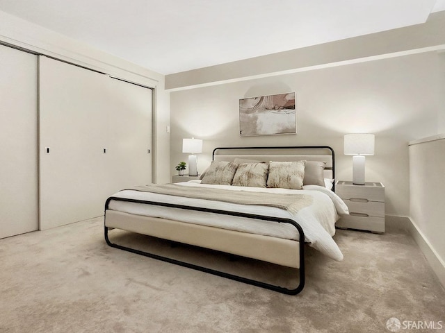 bedroom featuring light colored carpet