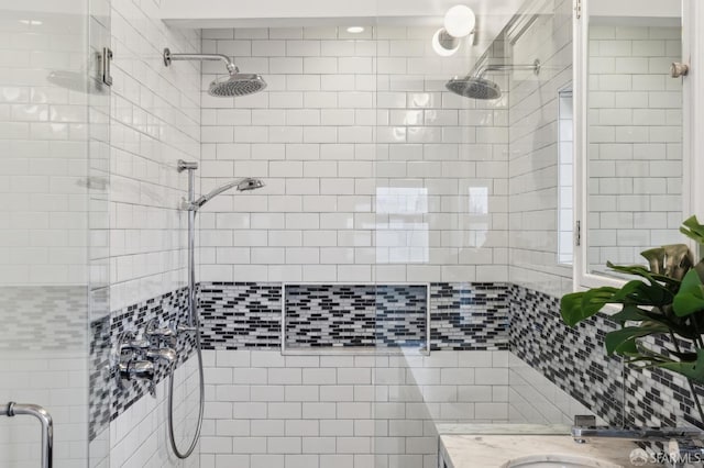 bathroom with sink and an enclosed shower