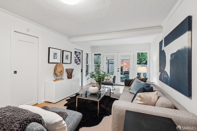 living room with light hardwood / wood-style floors, crown molding, a textured ceiling, beam ceiling, and french doors