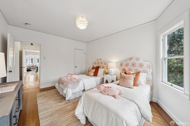 bedroom with light wood-type flooring