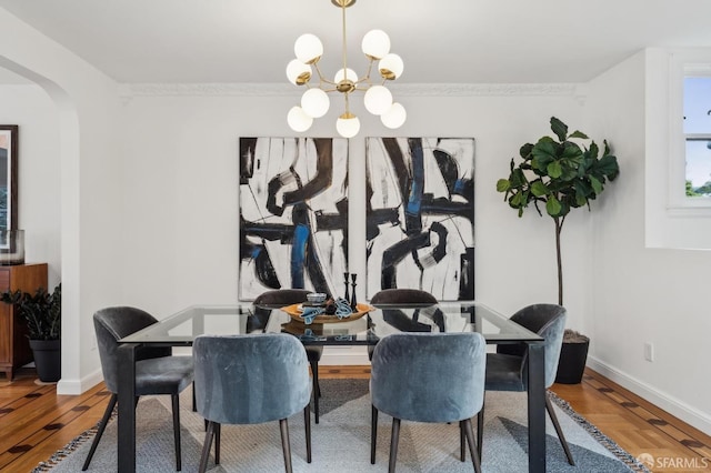 dining room featuring hardwood / wood-style flooring and an inviting chandelier