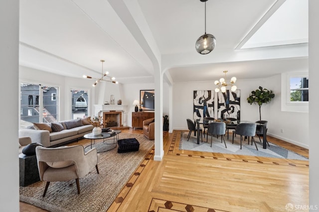 living room with hardwood / wood-style floors and a chandelier