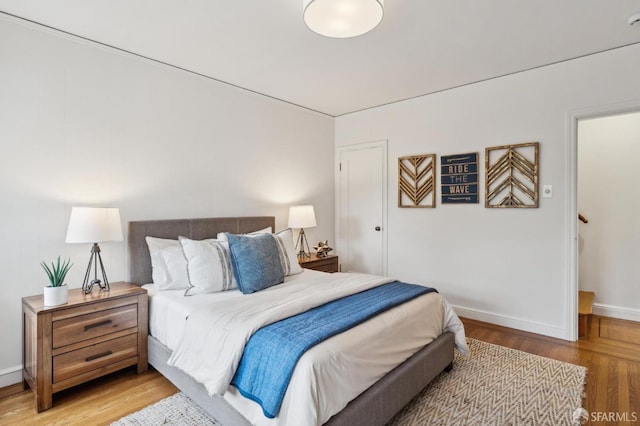 bedroom with light hardwood / wood-style floors