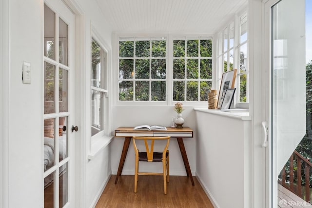 sunroom / solarium featuring breakfast area