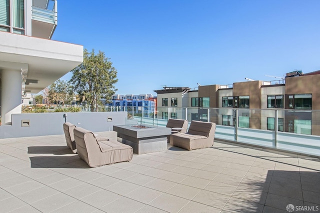 view of patio featuring an outdoor fire pit