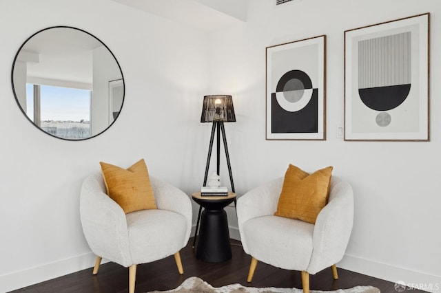 sitting room with dark hardwood / wood-style floors