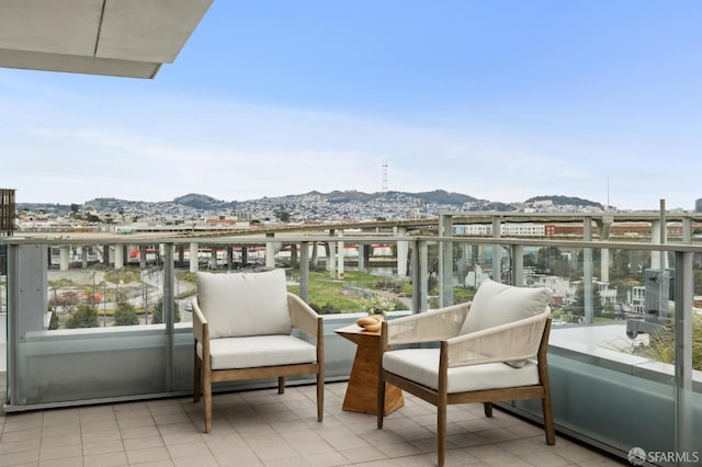 balcony featuring a mountain view