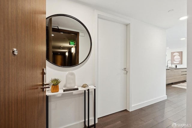 hall featuring dark wood-type flooring