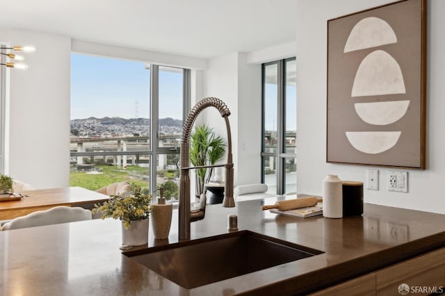 interior space featuring sink and an inviting chandelier