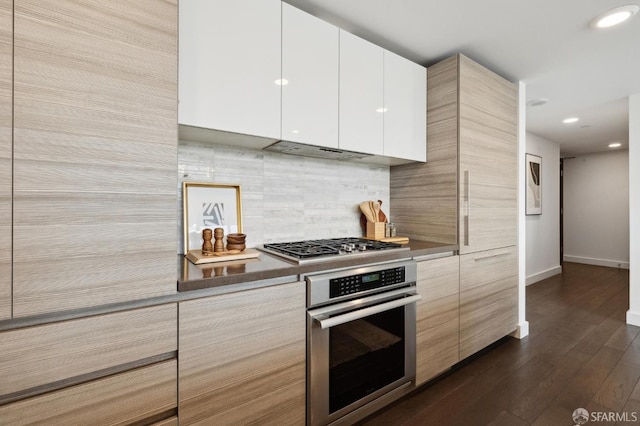 kitchen with backsplash, stainless steel appliances, dark hardwood / wood-style floors, custom range hood, and white cabinets