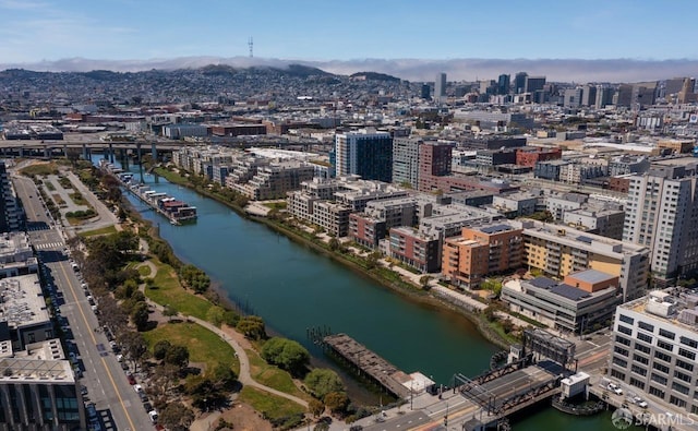 bird's eye view featuring a water and mountain view