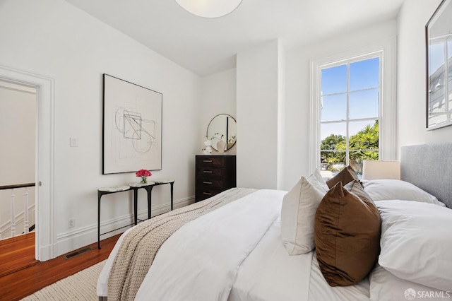 3470 20th St Unit 2, San Francisco, CA 94110 - bedroom featuring wood finished floors and baseboards