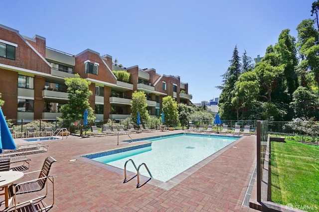 view of pool featuring a patio