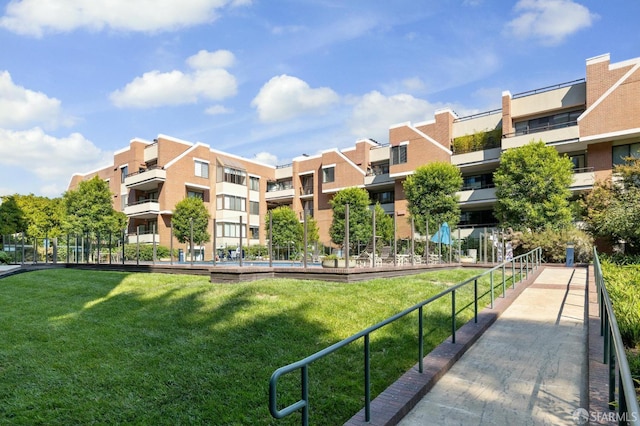 view of community featuring a lawn