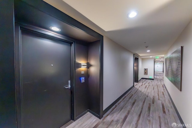 2655 Bush St Unit 119, San Francisco, CA 94115 - hallway with light wood-type flooring and recessed lighting
