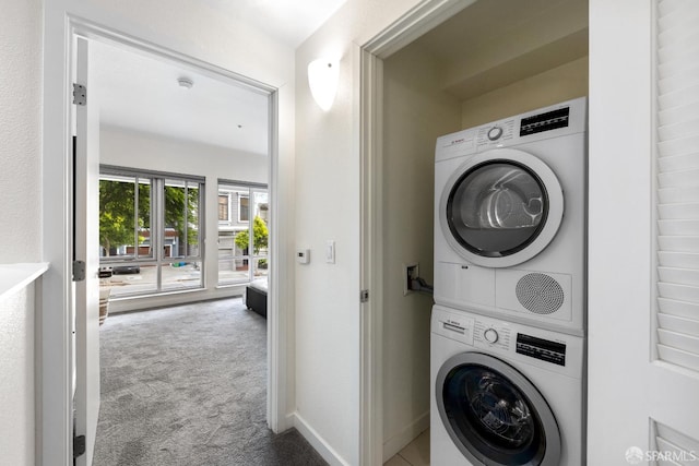 2655 Bush St Unit 119, San Francisco, CA 94115 - washroom featuring stacked washer / dryer and carpet