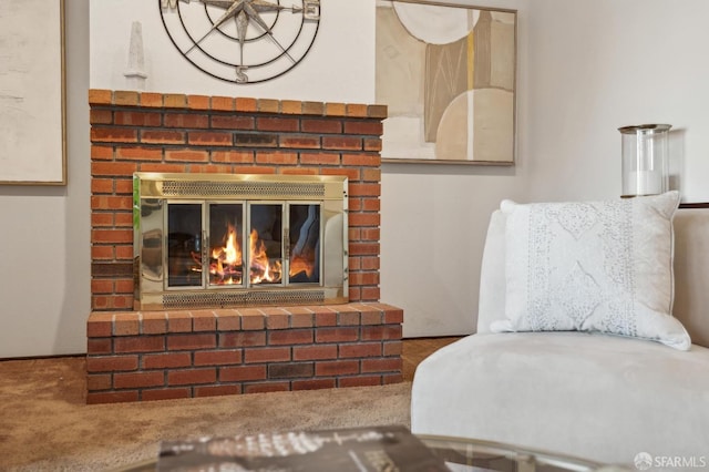 sitting room featuring carpet and a fireplace