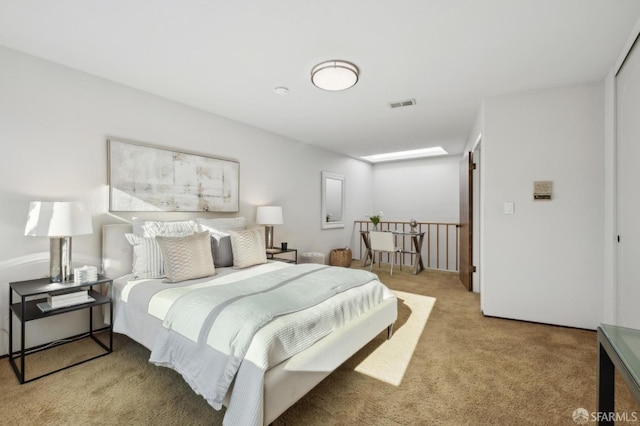 bedroom featuring light colored carpet