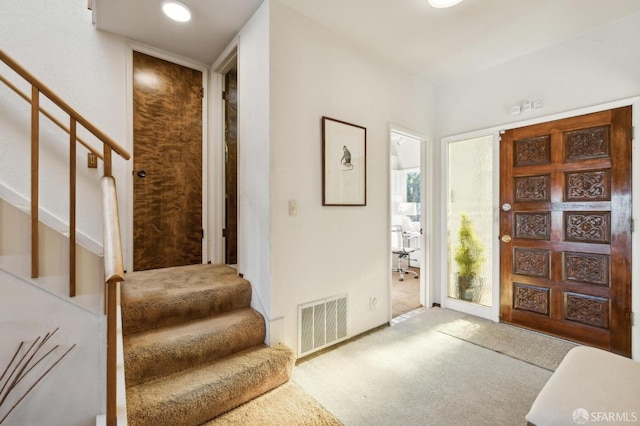 foyer featuring carpet