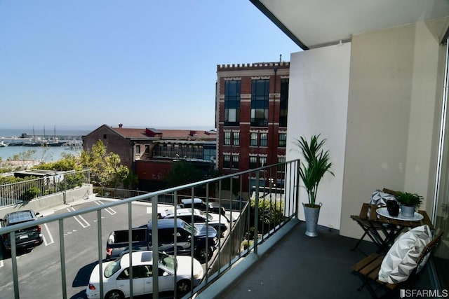 balcony featuring a water view