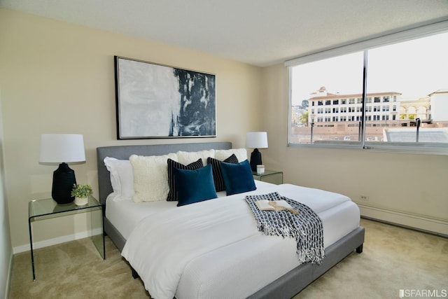 carpeted bedroom with baseboards