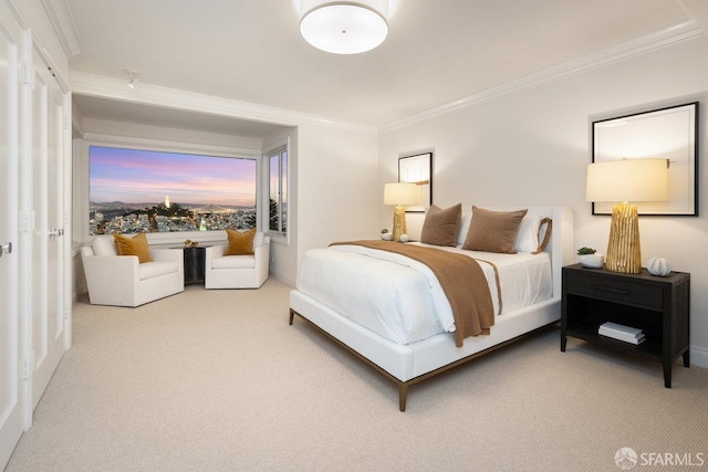 bedroom with carpet floors and ornamental molding