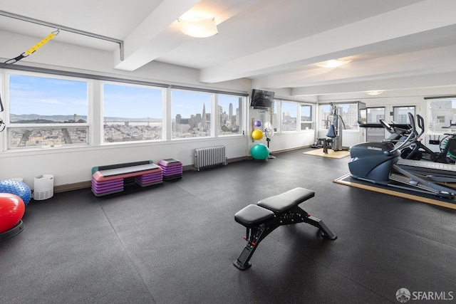 exercise room featuring radiator heating unit and baseboards