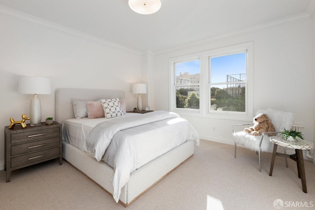 bedroom with light carpet, crown molding, and baseboards