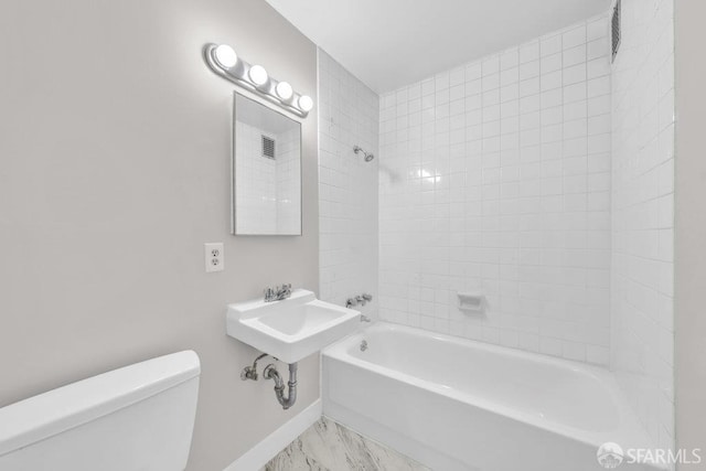 1315 Laguna St Unit 6, San Francisco, CA 94115 - full bath with toilet, marble finish floors, washtub / shower combination, and baseboards