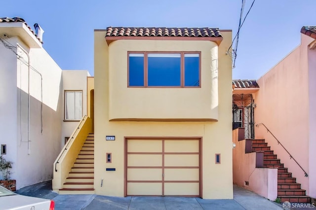 mediterranean / spanish-style house featuring a garage