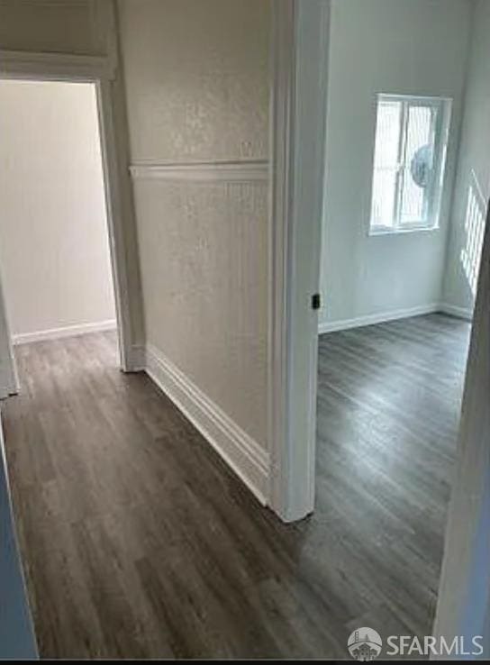 hallway featuring dark wood finished floors