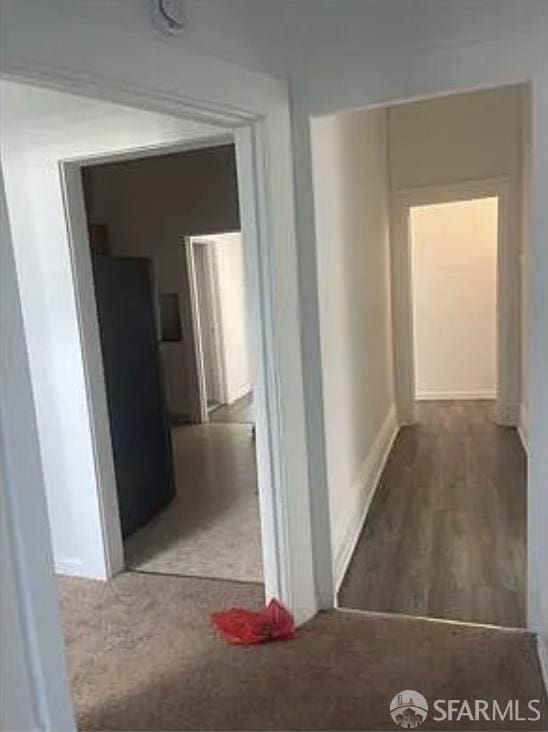 hall with wood finished floors