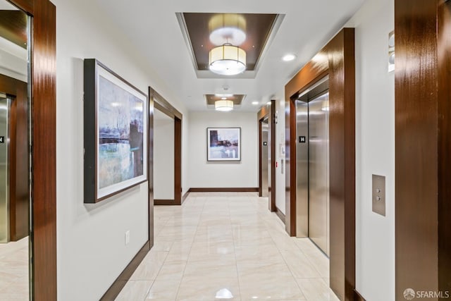 38 N Almaden Blvd Unit 1419, San Jose, CA 95110 - hall with a tray ceiling, elevator, baseboards, and recessed lighting