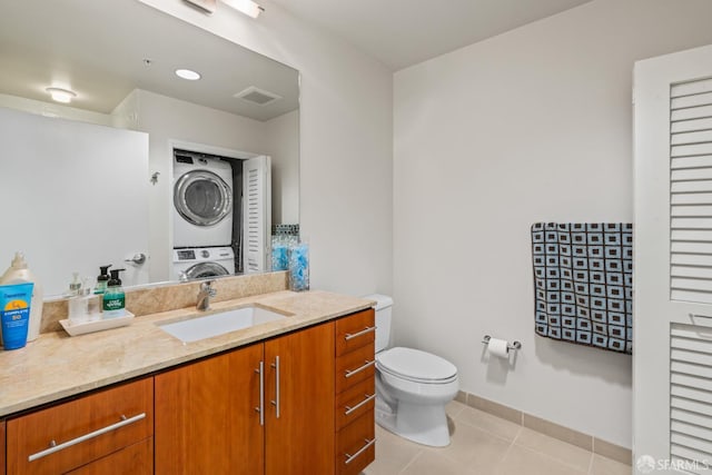 38 N Almaden Blvd Unit 1419, San Jose, CA 95110 - bathroom featuring stacked washer and clothes dryer, toilet, vanity, and tile patterned floors