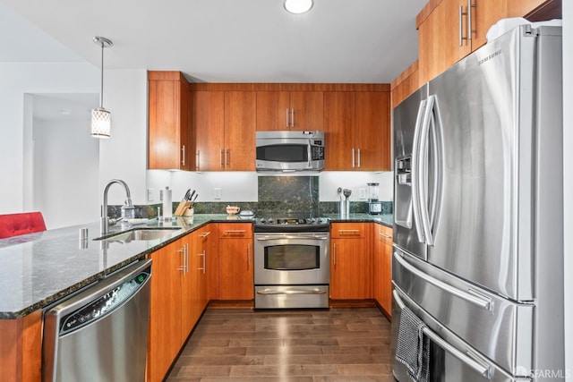 38 N Almaden Blvd Unit 1419, San Jose, CA 95110 - kitchen with appliances with stainless steel finishes, a sink, brown cabinetry, dark wood finished floors, and a peninsula