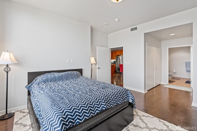 38 N Almaden Blvd Unit 1419, San Jose, CA 95110 - bedroom with dark wood-style floors, baseboards, and connected bathroom