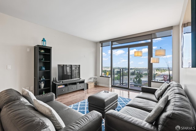 38 N Almaden Blvd Unit 1419, San Jose, CA 95110 - living room with wood finished floors, floor to ceiling windows, and baseboards
