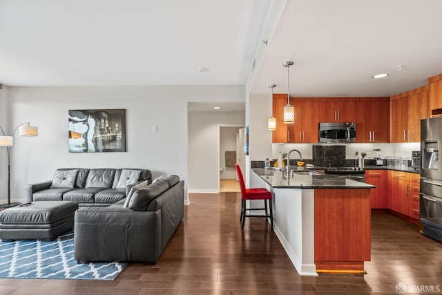 38 N Almaden Blvd Unit 1419, San Jose, CA 95110 - kitchen with appliances with stainless steel finishes, a peninsula, open floor plan, dark wood-style floors, and a sink